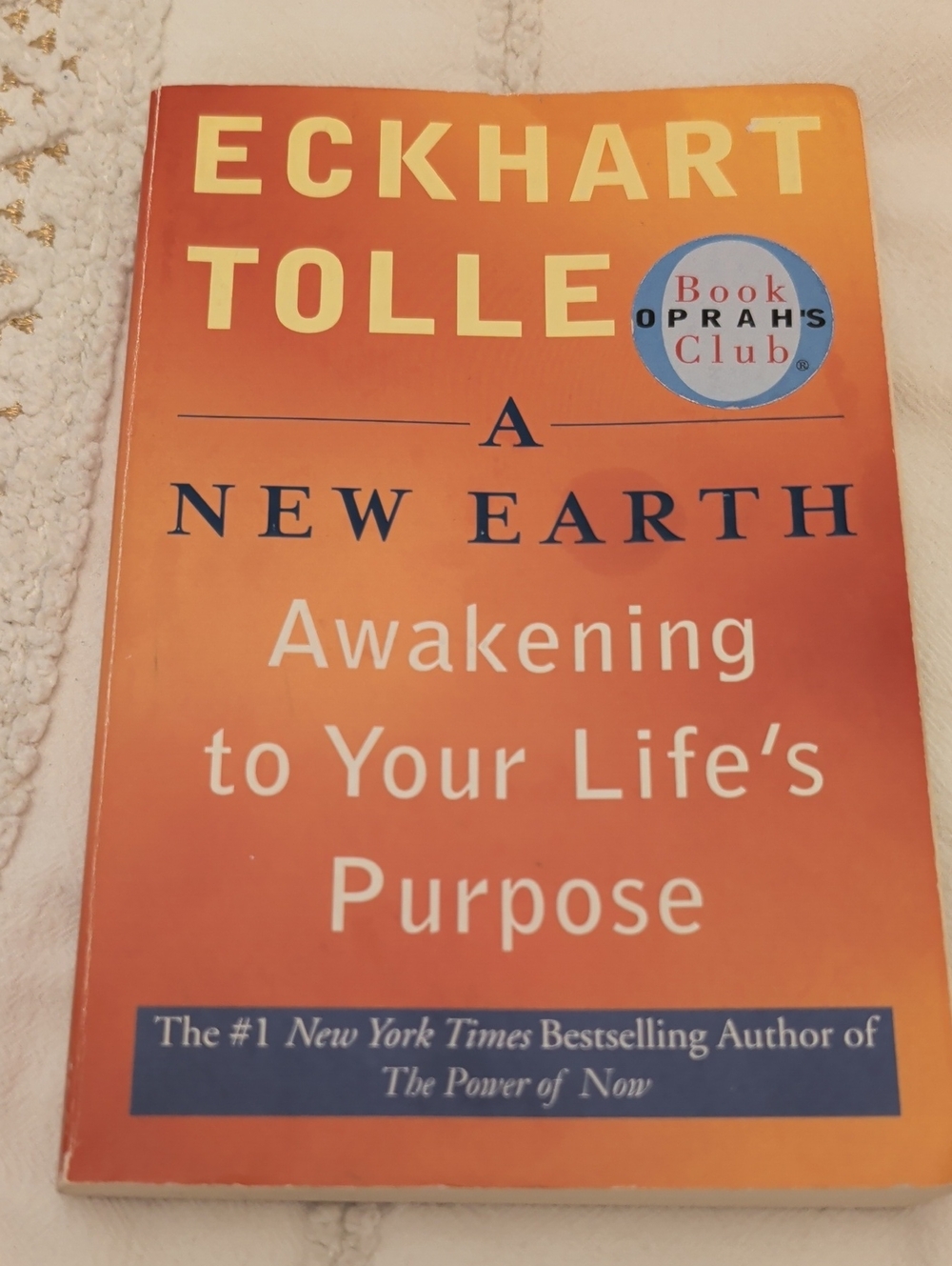 — A New Earth Paperback in Orange